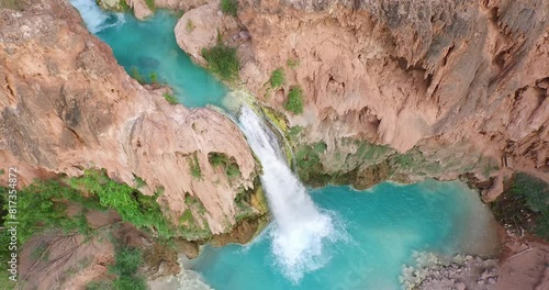 High drone shot lowering on beautiful desert waterfall in Arizona