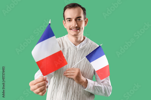 Handsome man with flags of ...