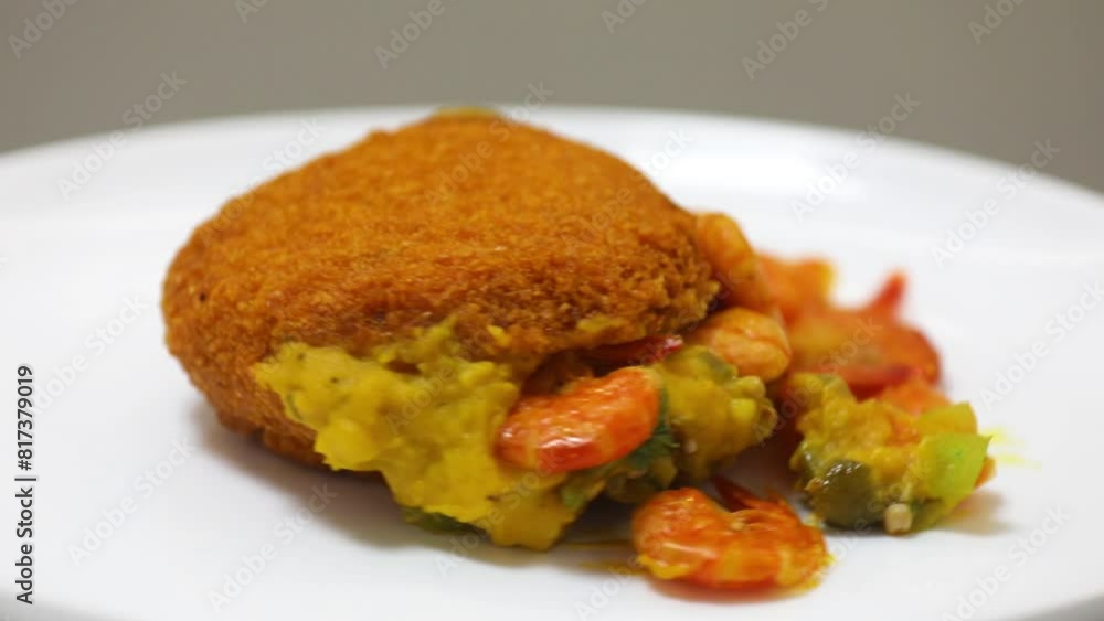 Traditional Brazilian acarajé, food of African origin based on vatapá, caruru and dry shrimp Traditional Brazilian acarajé, food of African origin based on vatapá, caruru and dry shrimp