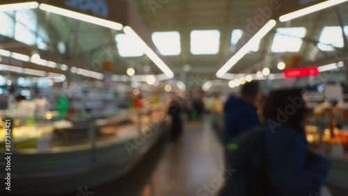 Blurry background footage of people in a central market