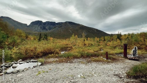 An underground geyser in Khibiny. Lake Maly Woodyavr. The purest water comes out of the ground. Valley of geysers. A thermal spring located in the middle of an endless valley, in a mountainous area.4К photo