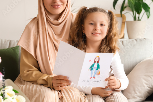 Little girl with greeting c...