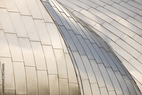 A building with a silver roof has a pattern of squares