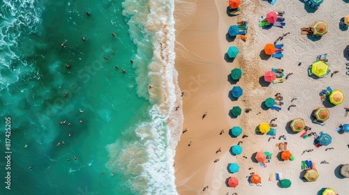 A birdseye view of a sandy beach adorned with colorful umbrellas, people enjoying the sun and water, against a backdrop of a vast blue sky AIG50