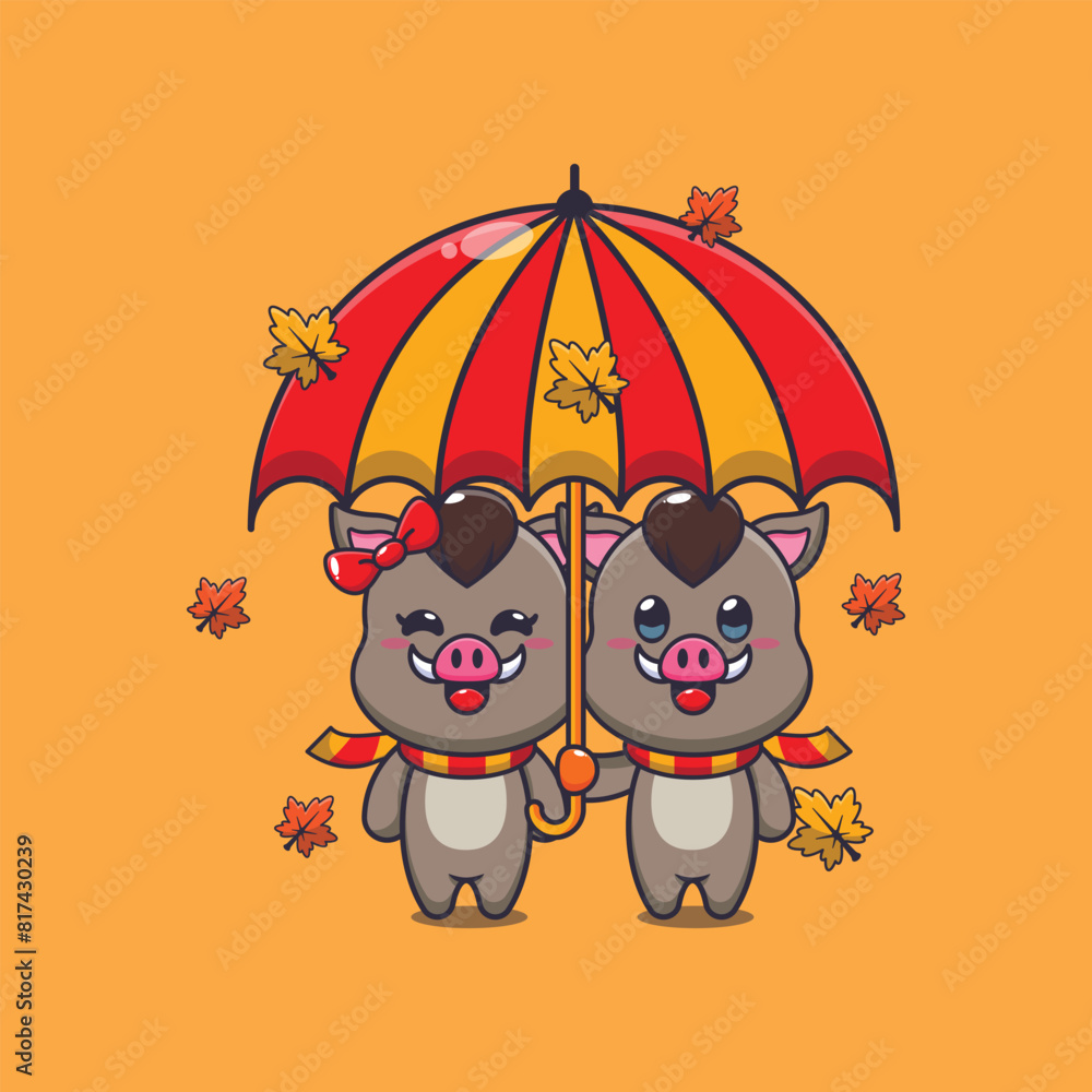 Obraz premium Cute couple boar with umbrella at autumn season
