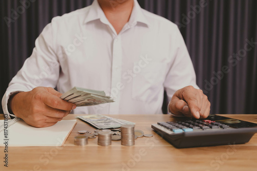 Businessman counting money money saving concept