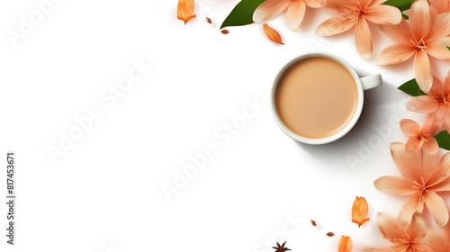 Tea with milk or popularly known as Teh Tarik isolated in white view from top with flower photo