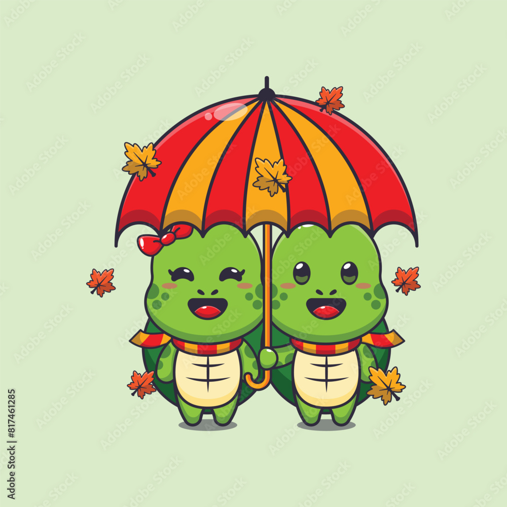 Obraz premium Cute couple turtle with umbrella at autumn season