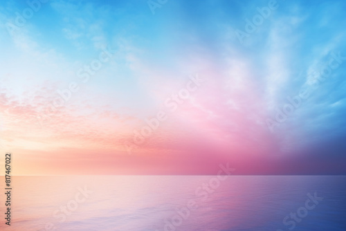 Serenely colorful sunset over the ocean, where soft pink and blue hues meld into a tranquil horizon, evoking peace and reflection.