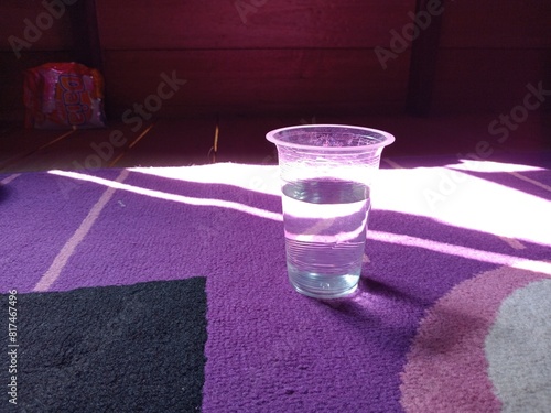 One empty disposable transparent plastic cup