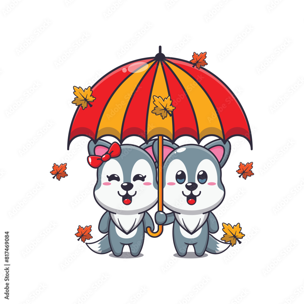 Cute couple wolf with umbrella at autumn season