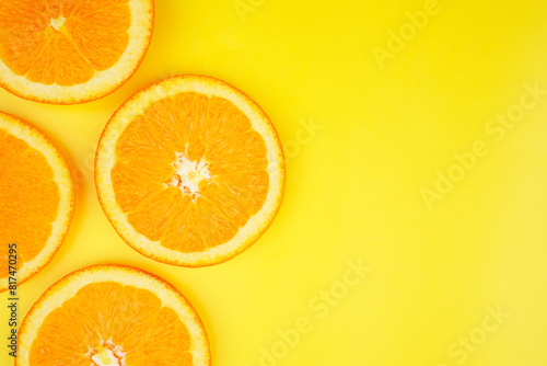 Summer fruit background concept  orange slice on yellow background
