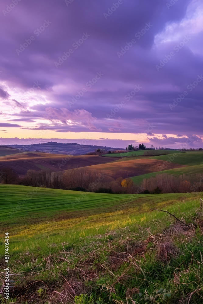 A peaceful countryside scene with rolling hills and farmland under a twilight purple sky, Generative AI 