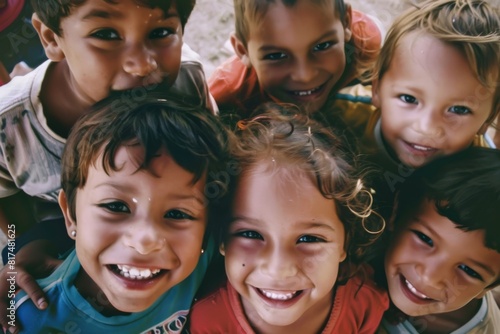 Group of children smiling and looking at the camera on a sunny day