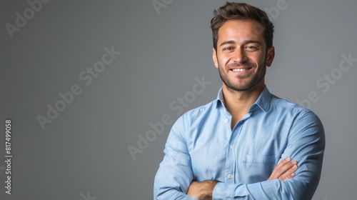 Confident Professional: Handsome Smiling Businessman in Blue Shirt isolated on gray background