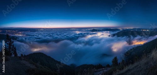 A mountaintop view of a cloud inversion at night, the clouds glowing softly below from the lights of unseen towns. 32k, full ultra HD, high resolution