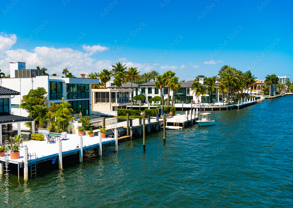 Luxury resort at summertime. Travel to tropical bay of Florida. Summer vacation in tropical paradise resort. Luxury summer villa with yacht pier. Vacation in summer paradise. Exotic paradise resort
