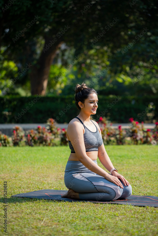 Female Yoga Mentor Closing Her Eyes and Sitting in Vajrasana Asana.
Female Yoga Mentor Closing Her Eyes and Sitting in Vajrasana Asana.