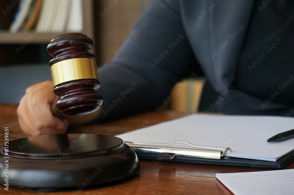 Legal counsel presents to the client a signed contract with gavel and legal law. Justice and lawyer law of advisor Concepts Legal counsel presents to the client a signed contract with gavel and legal law. Justice and lawyer law of advisor Concepts
