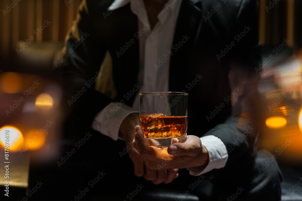 businessmen holding a glass of whiskey businessmen holding a glass of whiskey