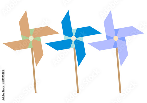 Tres molinillos de color azul, naranja y morado de juguete para niños.