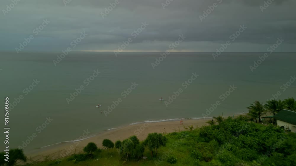 Forward aerial from bushy coast to open sea in cloudy Philippines Forward aerial from bushy coast to open sea in cloudy Philippines