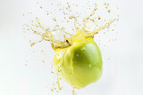 Green apple flying in splash on light background. Fruits juice advertising.