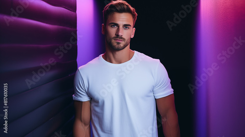 Handsome man wearing a white T-shirt in a studio with vivid backgrounds
