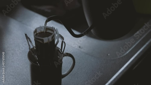 brewing coffee in a dimly lit kitchen. drip coffee. 薄明りのキッチンでコーヒーを淹れる。ドリップコーヒー photo