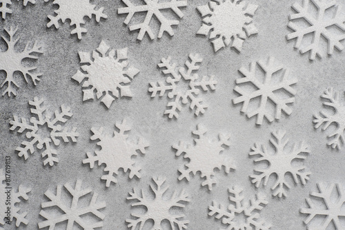 White snowflakes on a gray background