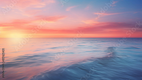 Tranquil seascape with vibrant setting sun and gentle waves.