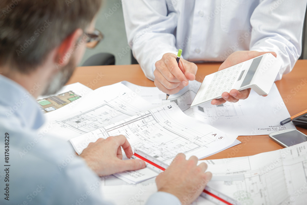 two architects talking during meeting two architects talking during meeting