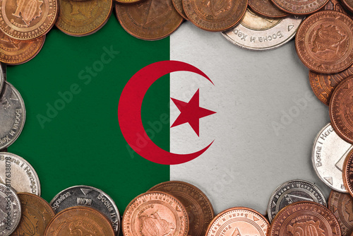 Coins on flag of Algeria . trading investment business currency concept.