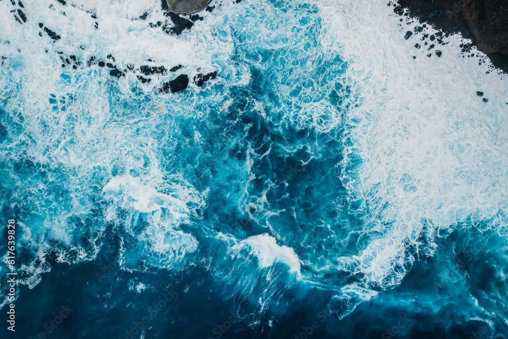 Aerial view of rough ocean with waves and volcanic beach, porto Moniz Madeira, Portugal Aerial view of rough ocean with waves and volcanic beach, porto Moniz Madeira, Portugal