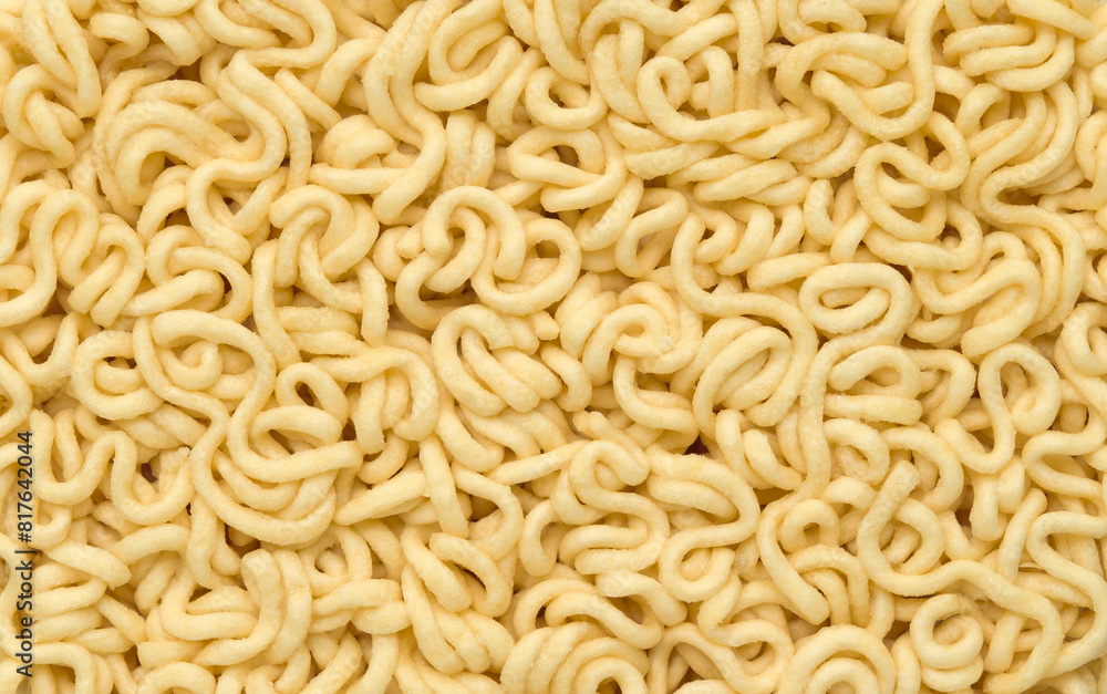 Instant noodle, Ramen Noodles Uncooked texture background top view Instant noodle, Ramen Noodles Uncooked texture background top view