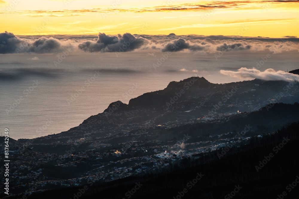 beautiful sunset over the city of Funchal on Madeira from the location Miradouro do Pico Alto. Mountains landscape beautiful sunset over the city of Funchal on Madeira from the location Miradouro do Pico Alto. Mountains landscape