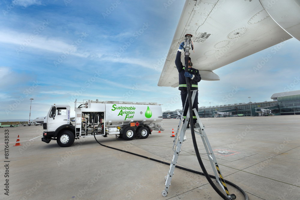 Safe Refuling Technician is refueling aircraft with Sustainable Aviation Fuel (SAF ...