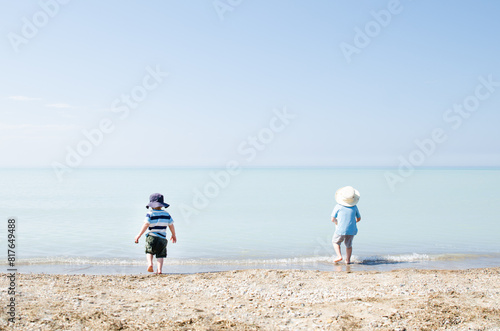 Children playing in gentle surf on Lake Huron photo