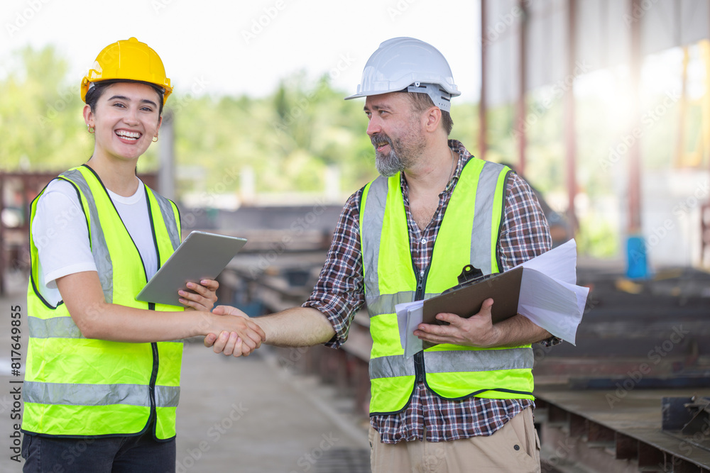 Engineers shaking hands at construction site, Construction workers handshake with factory foreman workers at the precast concrete factory site Engineers shaking hands at construction site, Construction workers handshake with factory foreman workers at the precast concrete factory site