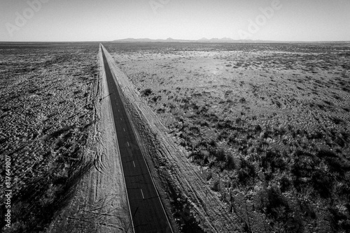 aerial view of long straight road across west Texas desert photo