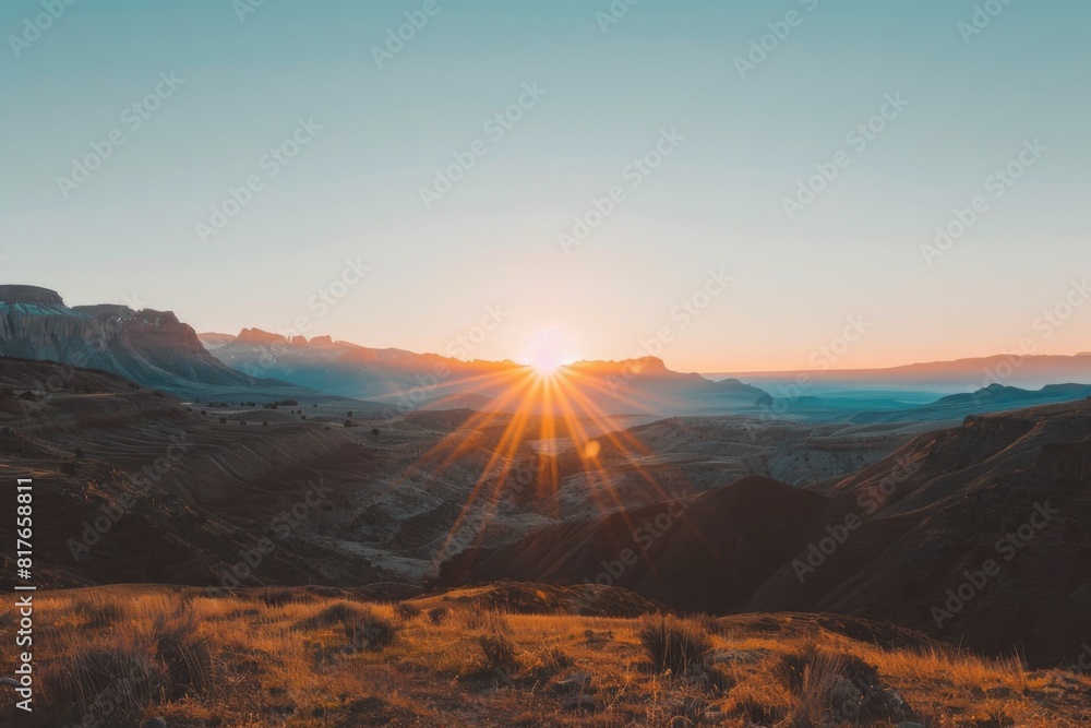 Naklejka premium Golden Sunrise Over Desert Mountains