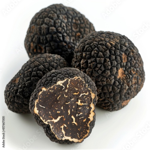 Pile of black truffles on a clean white surface