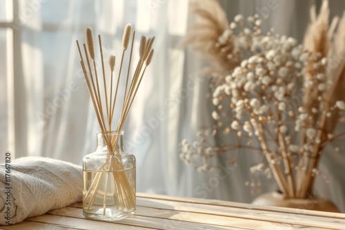 Aromatic reed air freshener on wooden table with text space