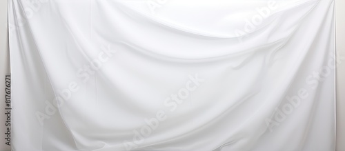 A copy space image of a white background with a sheet placed on it