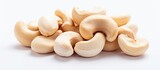 Close up of raw cashew nuts on a white background with copy space image