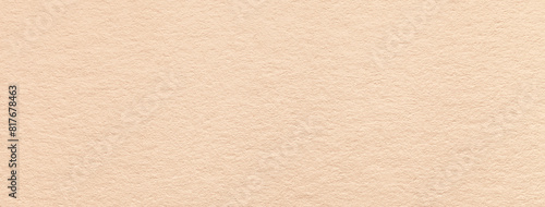 Texture of craft light beige paper background colors, macro. Structure of vintage kraft cream cardboard.
