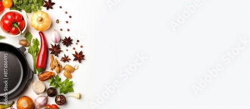 Copy space image of cooking ingredients and cookware arranged on a white background as seen from top view within a frame