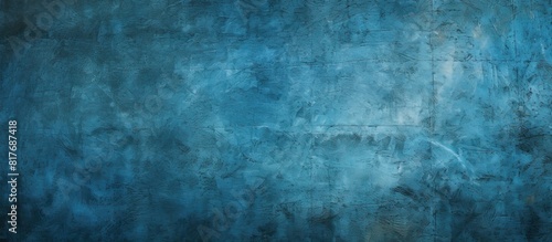A grungy blue background with a scratched and dotted texture providing ample copy space for images