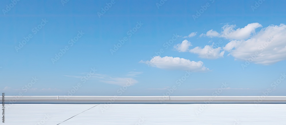 On the building s roof corner there is a copy space image set against the backdrop of the blue sky On the building s roof corner there is a copy space image set against the backdrop of the blue sky