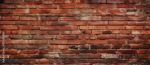 The grunge red brick wall provides a textured background with ample copy space for adding images or text